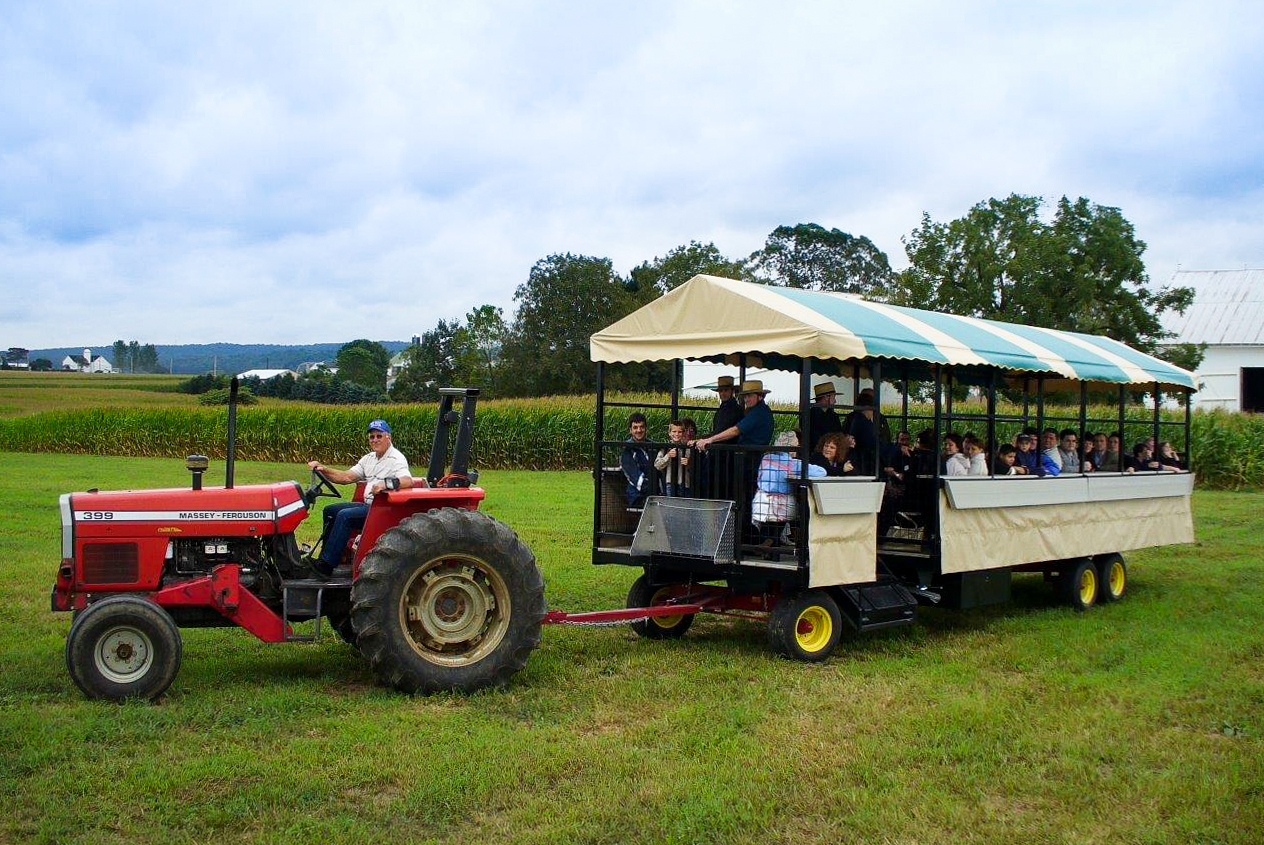 tractor pulling custom farm equipment trailer