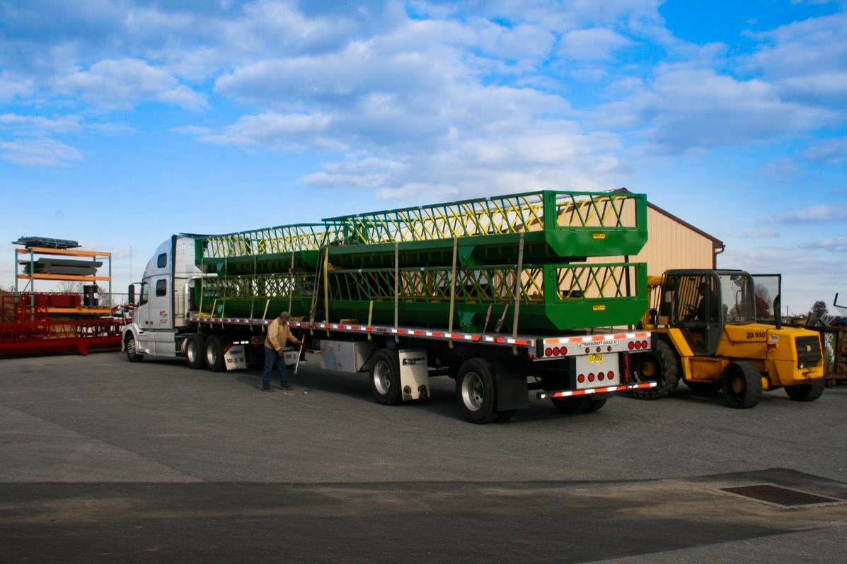 4 large custom hay feeders on trailer