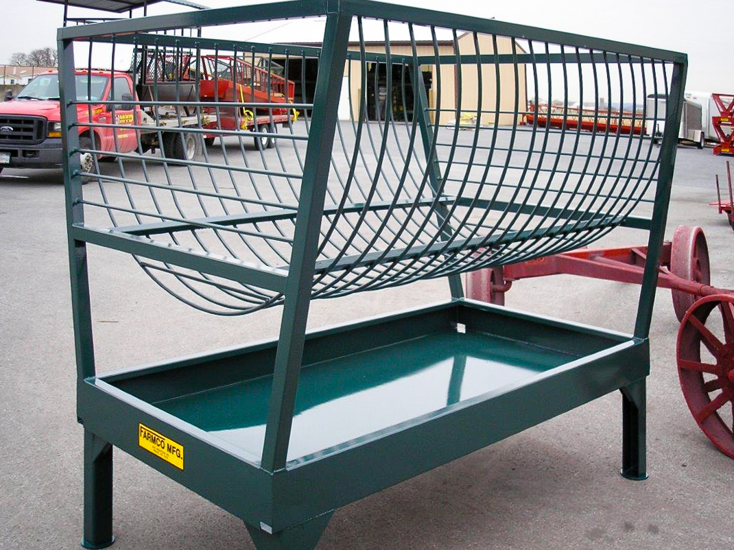 green/blue hay feeder on the custom farm equipment