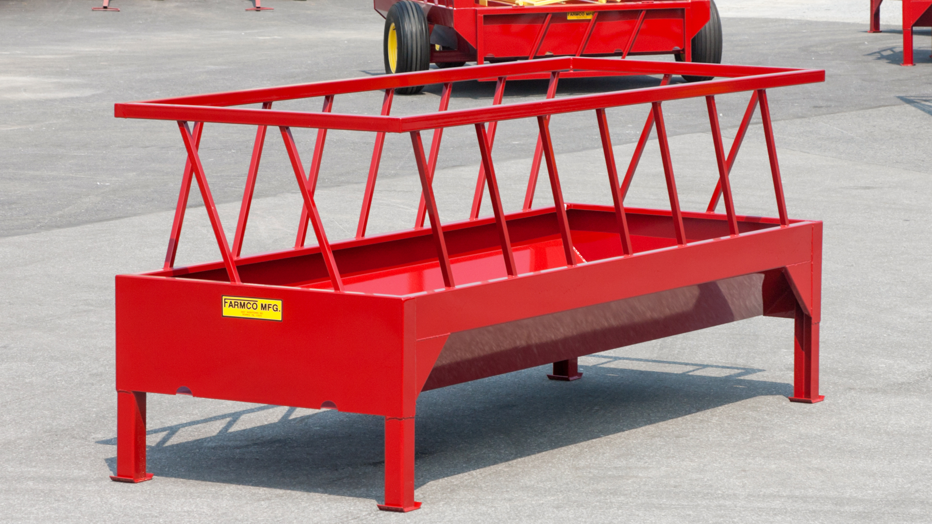 closeup of red bunk feeder waste hay feeder for cattle for sale