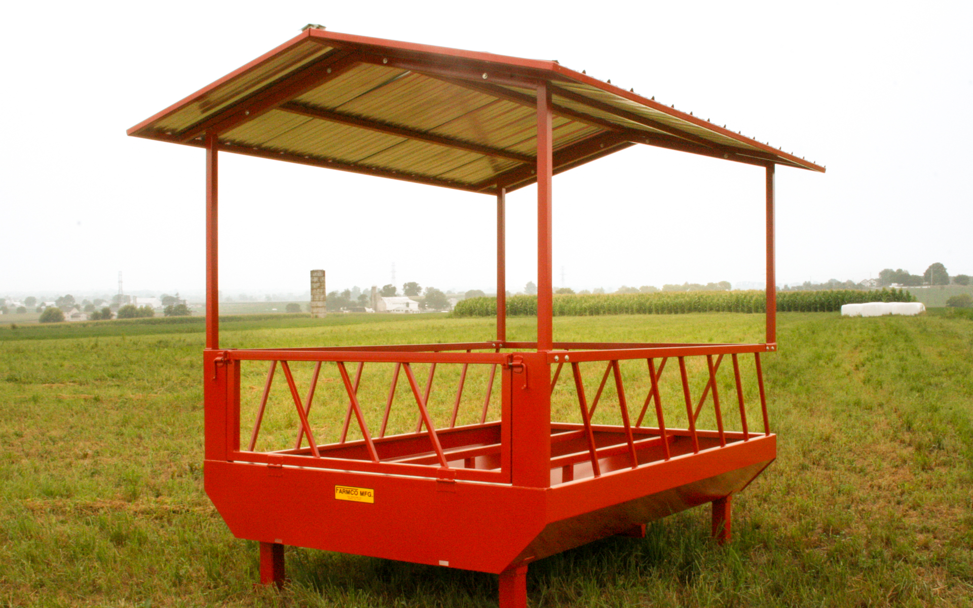 covered cattle feeder as example of how to keep cows from wasting hay