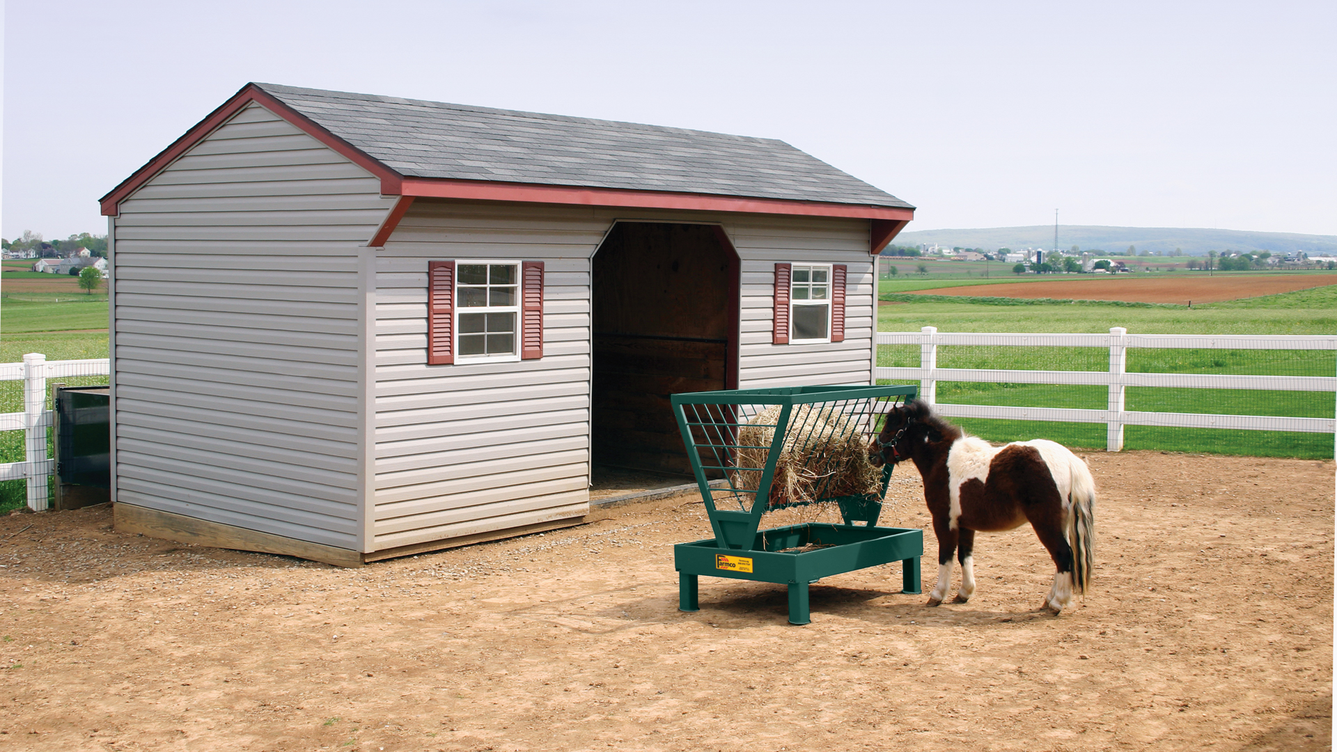 exterior photo of horse by shed and hay for why do horses pee on their hay post